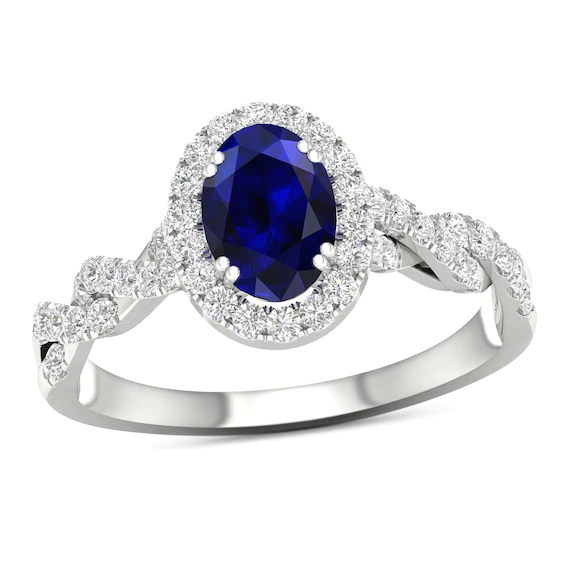 Oval Blue Sapphire and 0.33 CT. T.w. Diamond Frame Twist Shank Ring in